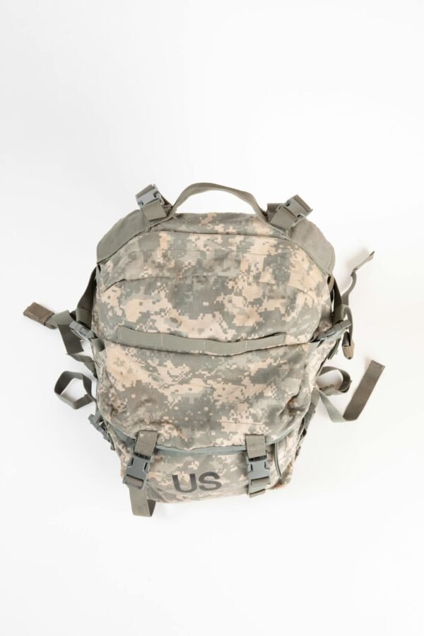 Top view of a camouflage military backpack isolated on a white background.